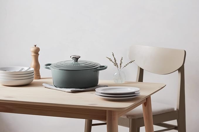 Elegant Le Creuset Dutch Oven in a vibrant color, ideal for slow-cooked meals and kitchen decor.